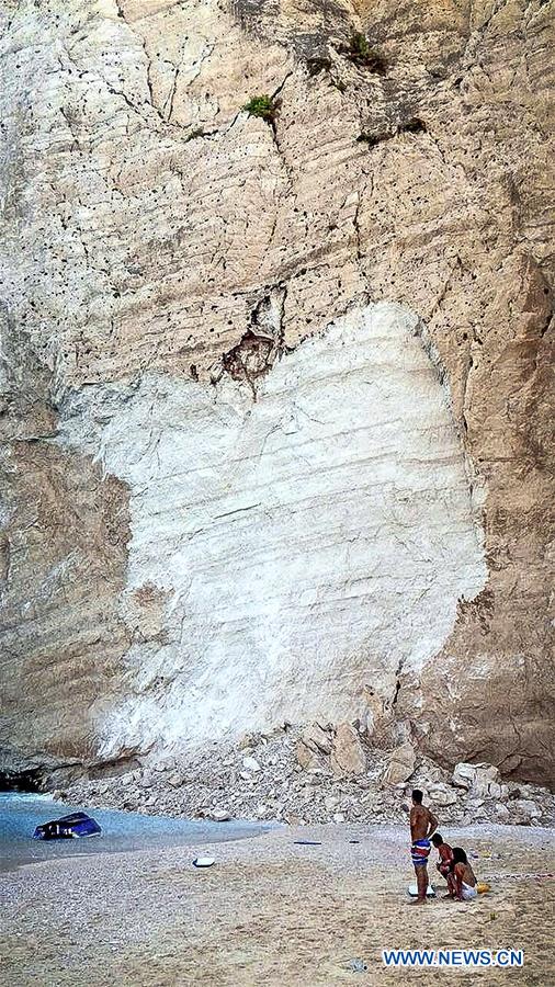 GREECE-ZAKYNTHOS-NAVAGIO BEACH-ROCK SLIDE