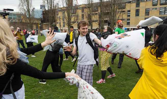 People have fun on Int'l Pillow Fight Day in London